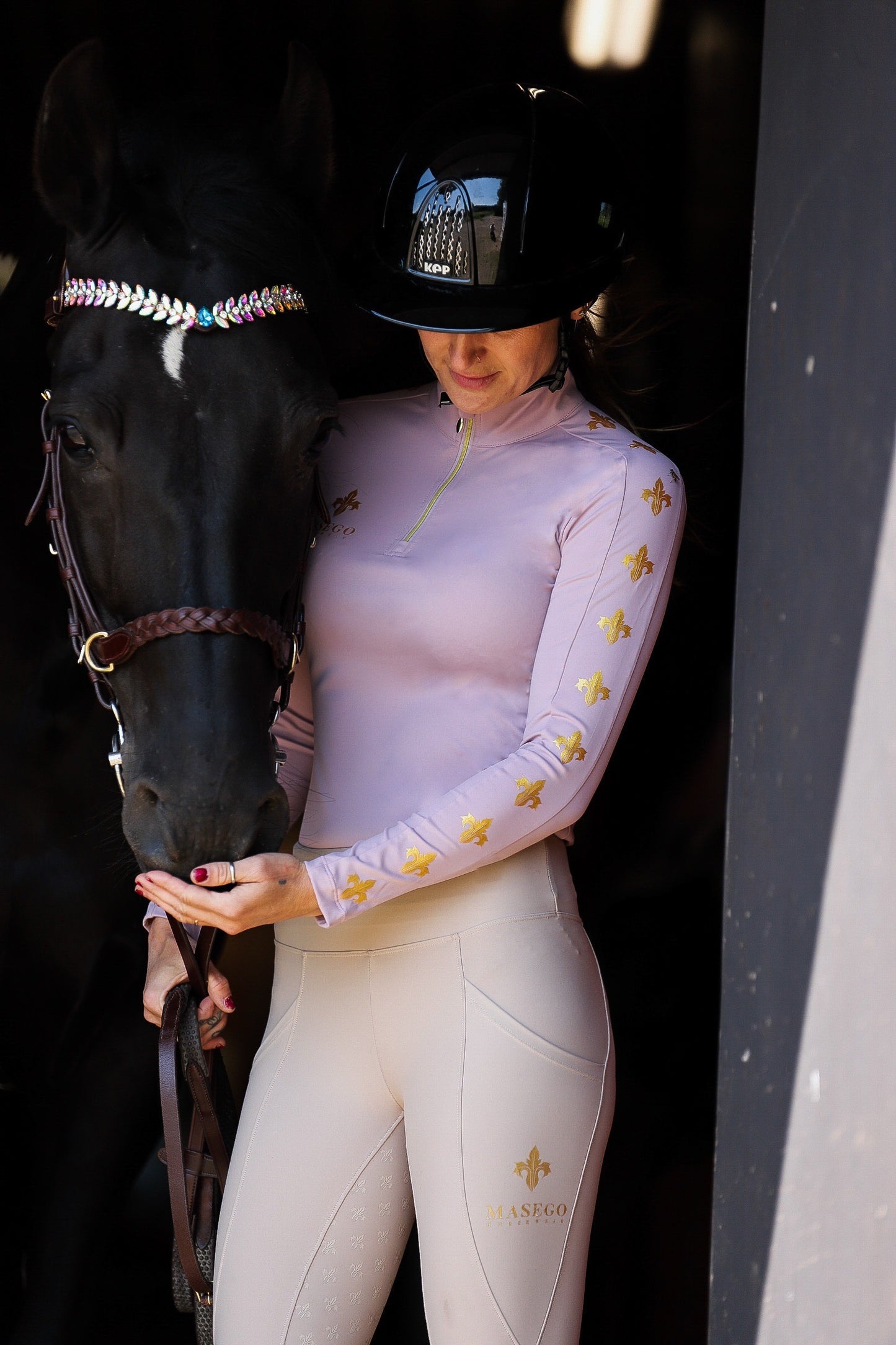 MASEGO riding top