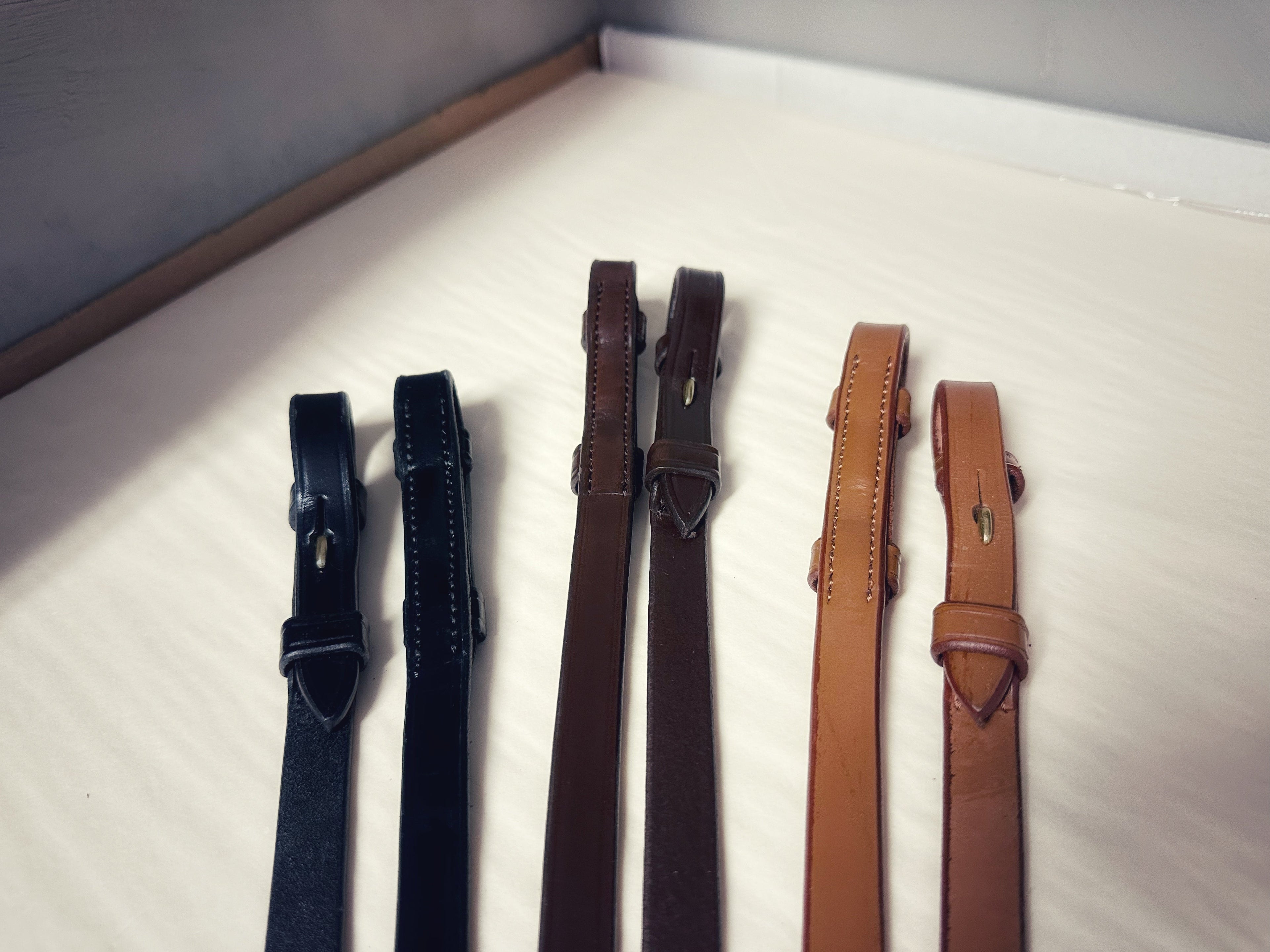 Slim plain leather reins in black, brown, and tan with brass details, soft Italian leather, 1.3 cm width, ideal for double reins riding