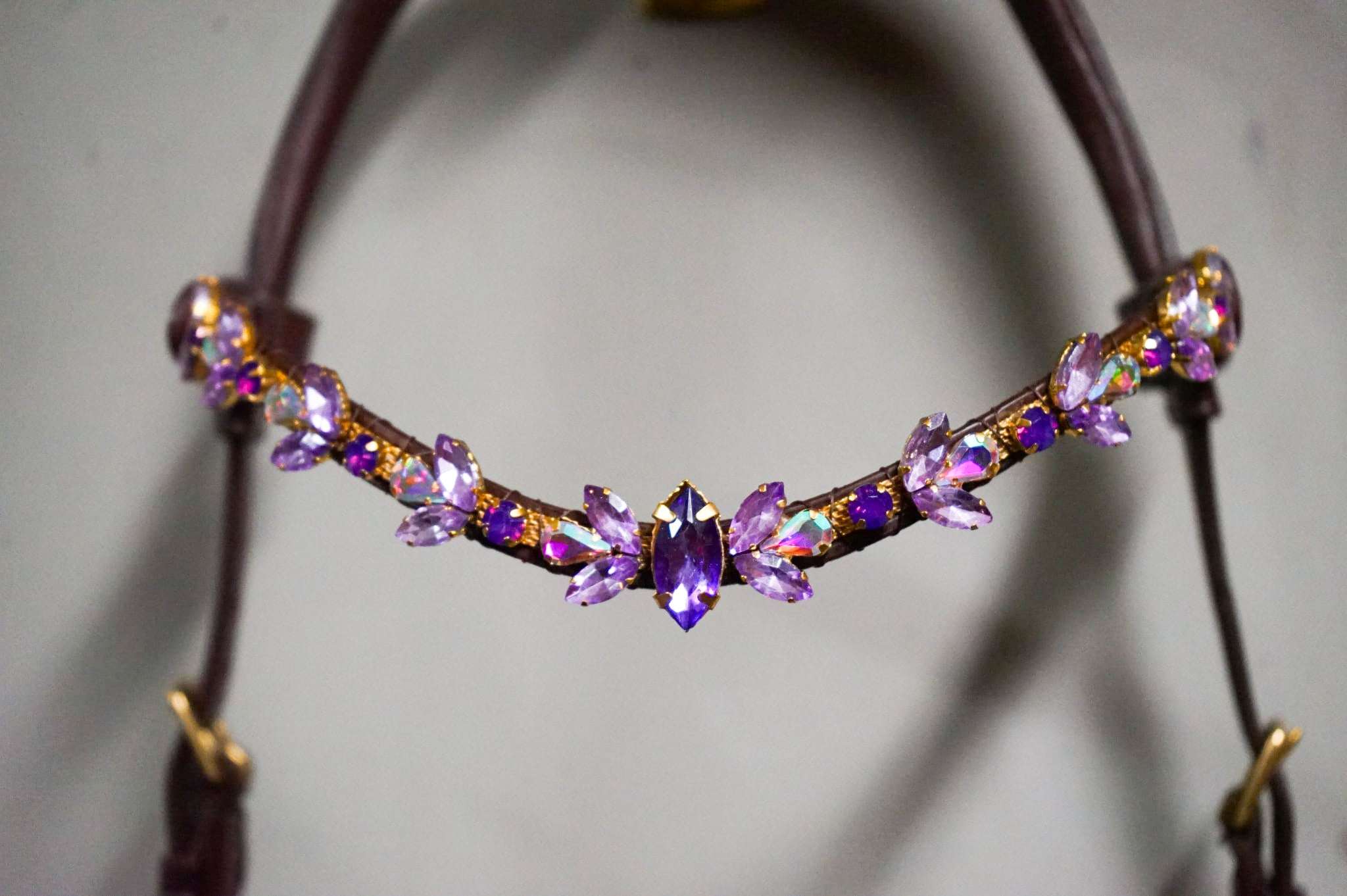 Royal Amethyst soft leather hand-stitched accessory with crystal chain and brass hardware