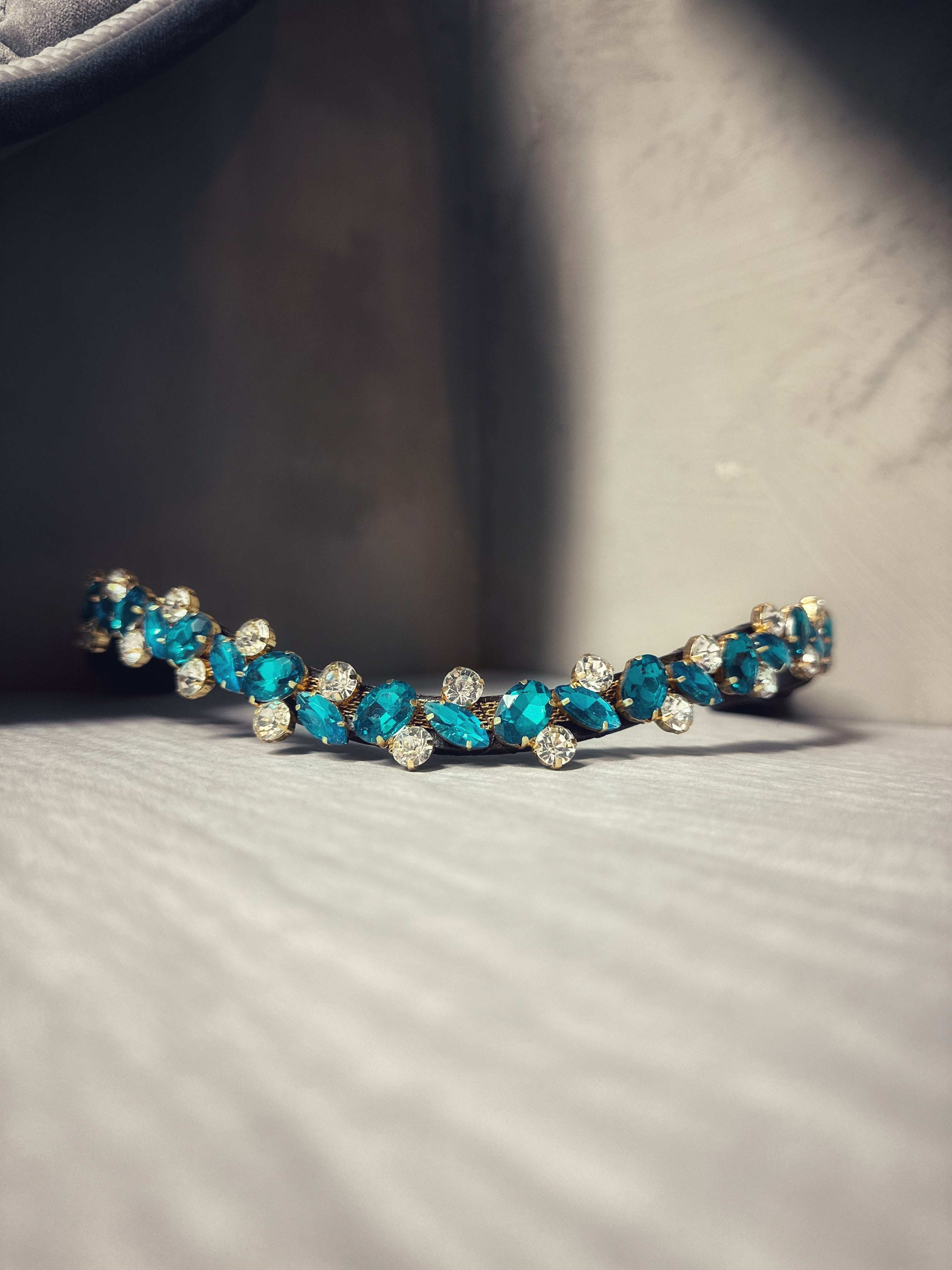 Sample nr.2 brown full bracelet with blue and clear gemstones on gray surface