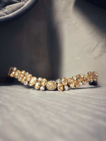 Load image into Gallery viewer, Sample nr.4 brown full gemstone bracelet with gold-toned setting on gray background
