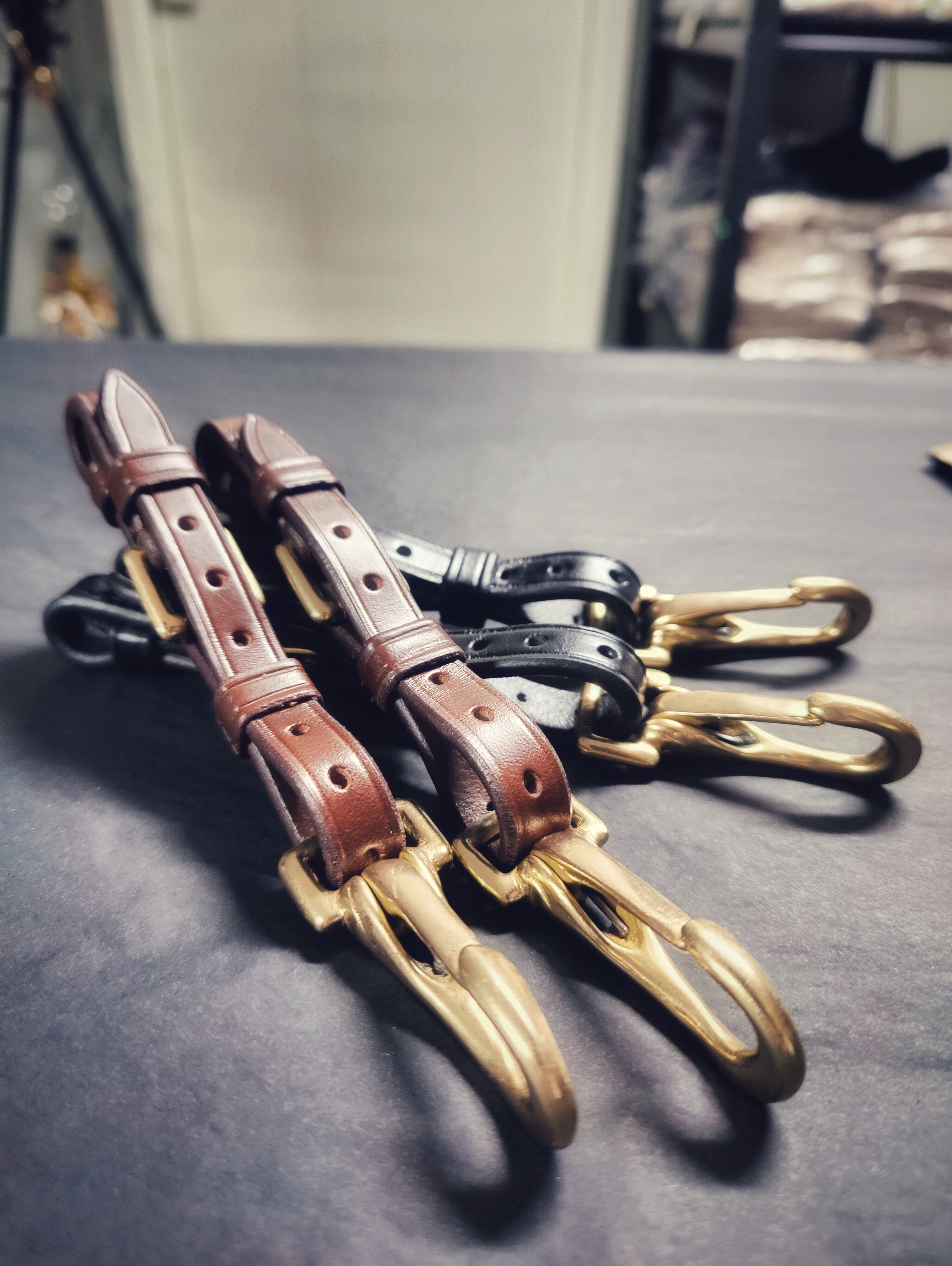 Adjustable bitstrap set in black and brown Italian leather with brass hardware and hooks