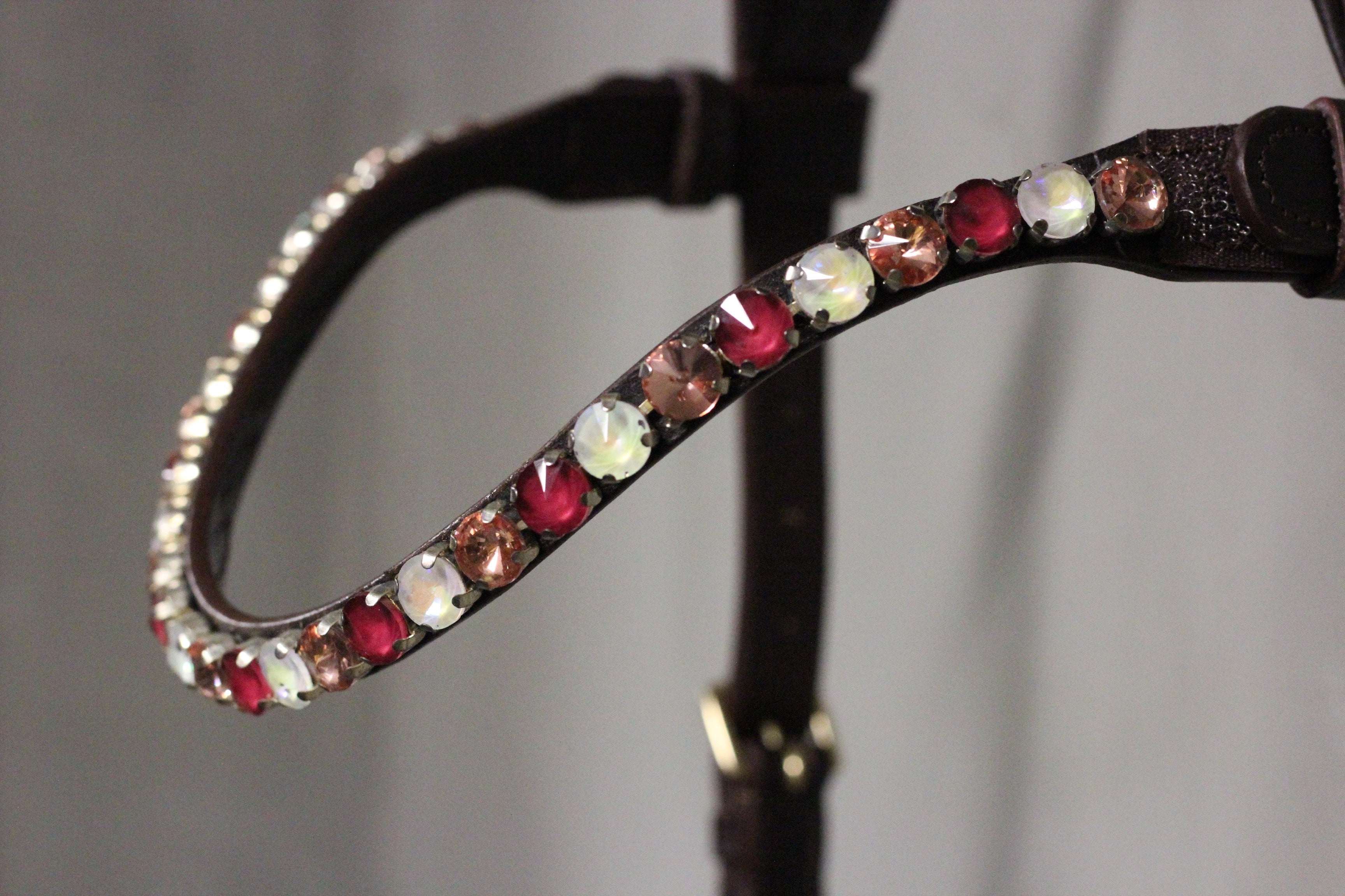 Chunky Swarovski Berries browband with red, cream, and brown crystals on dark leather strap