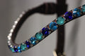 Chunky Swarovski browband with emerald and blue crystals in pyramid shape on leather band