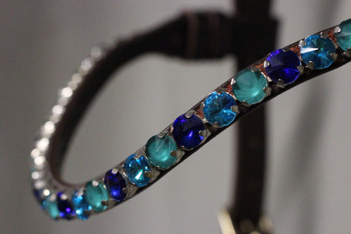 Chunky Swarovski browband with emerald and blue crystals in pyramid shape on leather band