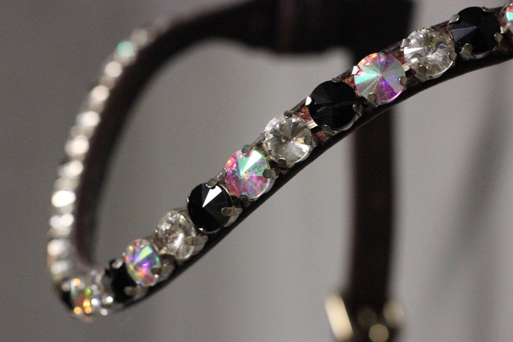 Close-up of Chunky Swarovski Onyx and Ice browband with alternating black and clear pyramid-shaped crystals on leather strap