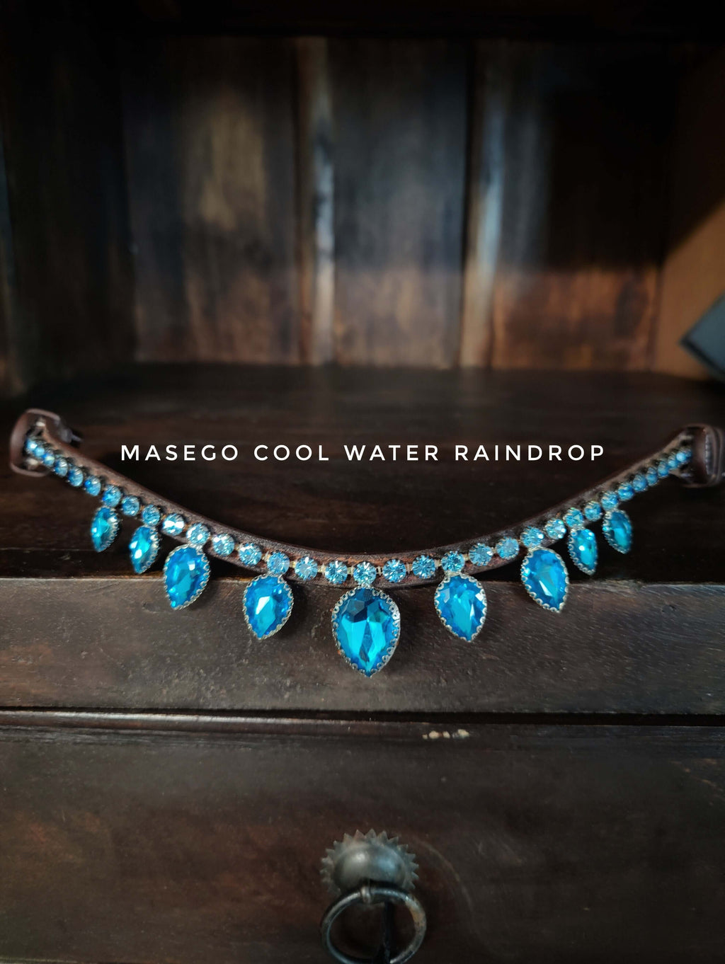 Cool water raindrop browband with blue drop-shaped crystals and white stitching on soft leather
